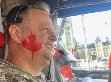 A person with a red maple leaf on his face

Description automatically generated