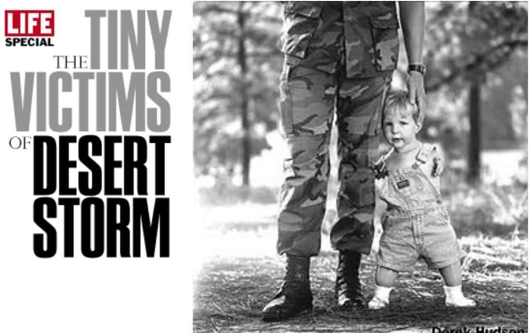 A person in military uniform holding a child Description automatically generated